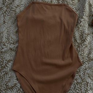 tan body suit